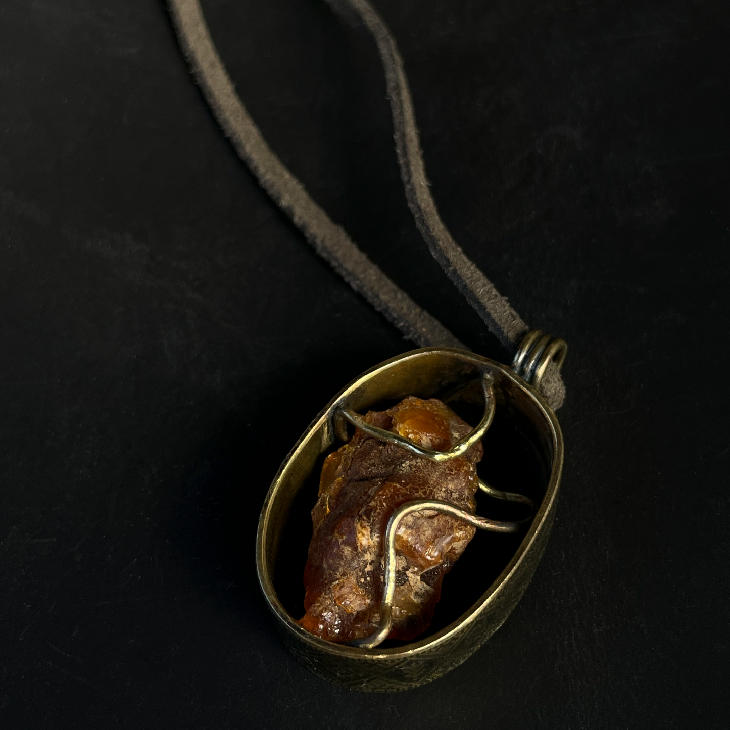 Pendant "Amber in a Cage"